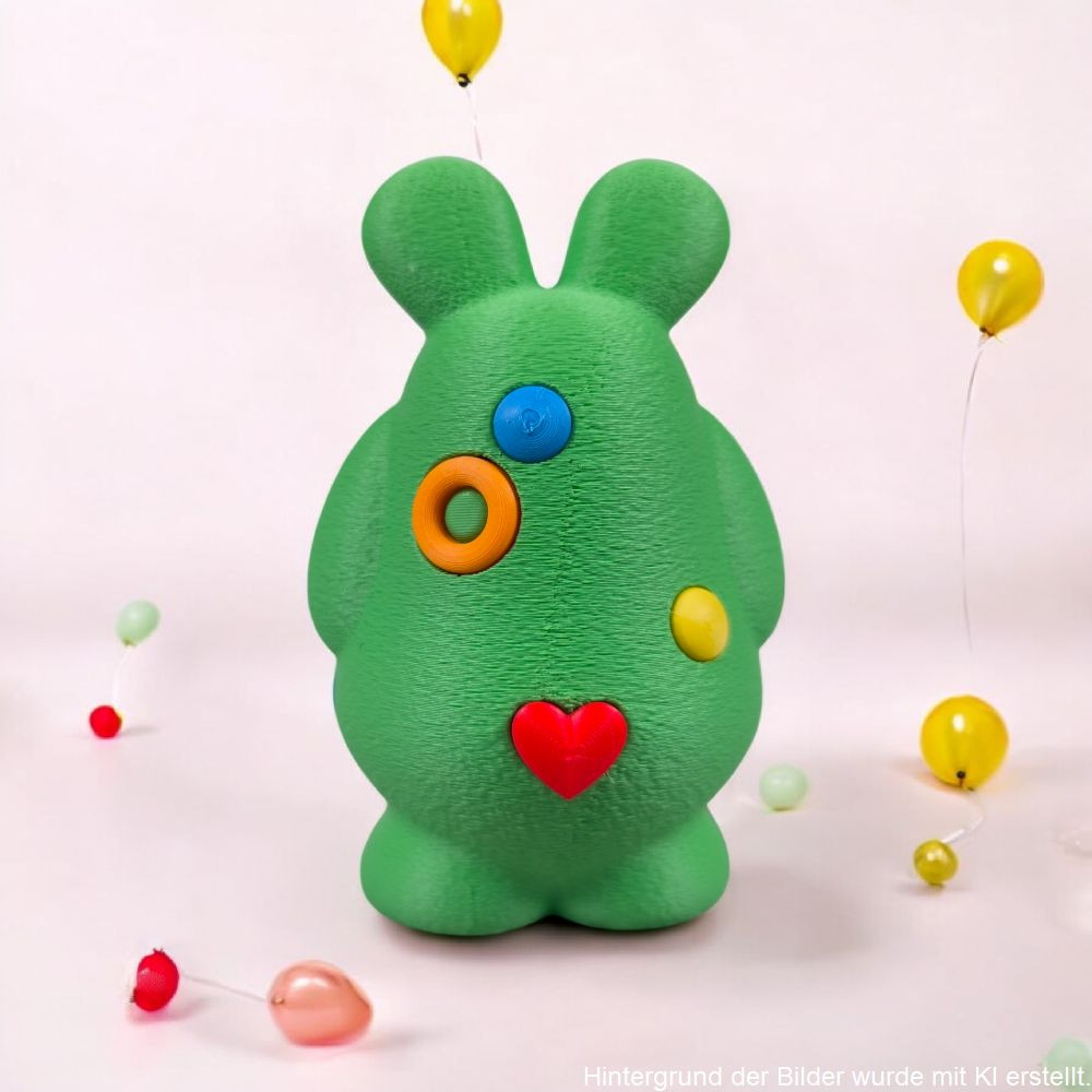 3D-Druck Mutmachmonster „Hugo“ mit großen Augen und bunten Punkten, freundliche Figur als Geschenkidee